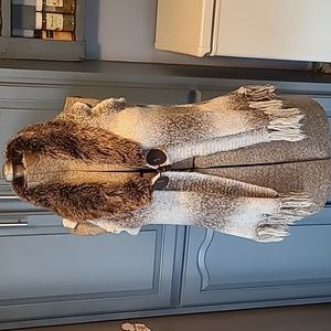 Vintage sleeveless jacket with faux fur and fringe bottom. Like new